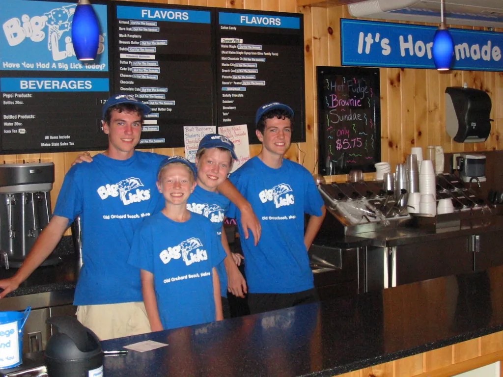 The four Langlois boys — Christian, Cameron, Chandler and Connor — in matching Big Licks shirts behind the counter