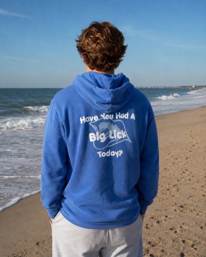 The back of the Big Licks hooded sweatshirt on a man, reading Have You Had A Big Lick Today?