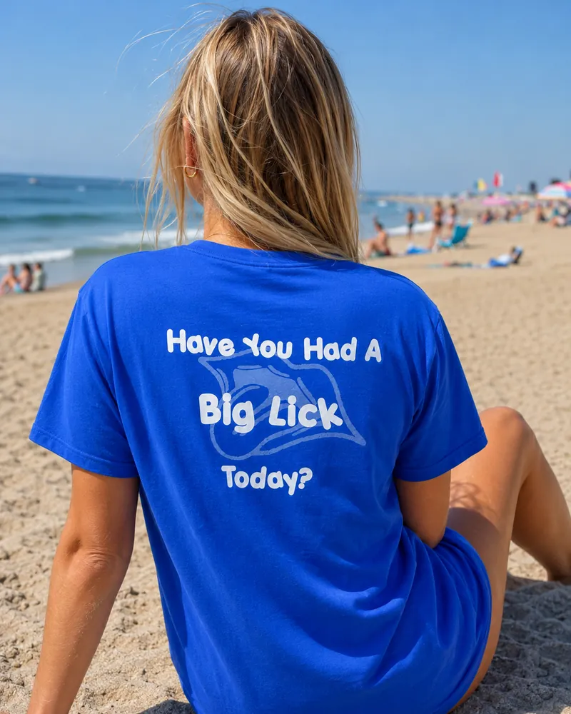 The back of the Big Licks t-shirt on a woman, reading Have You Had A Big Lick Today?