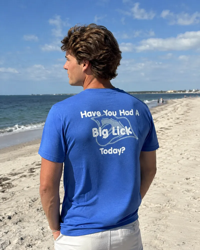 The back of the Big Licks t-shirt on a man, reading Have You Had A Big Lick Today?