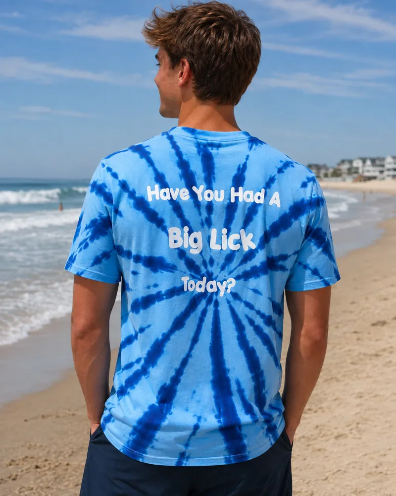 The back of the tie-dye Big Licks t-shirt on a man, reading Have You Had A Big Lick Today?